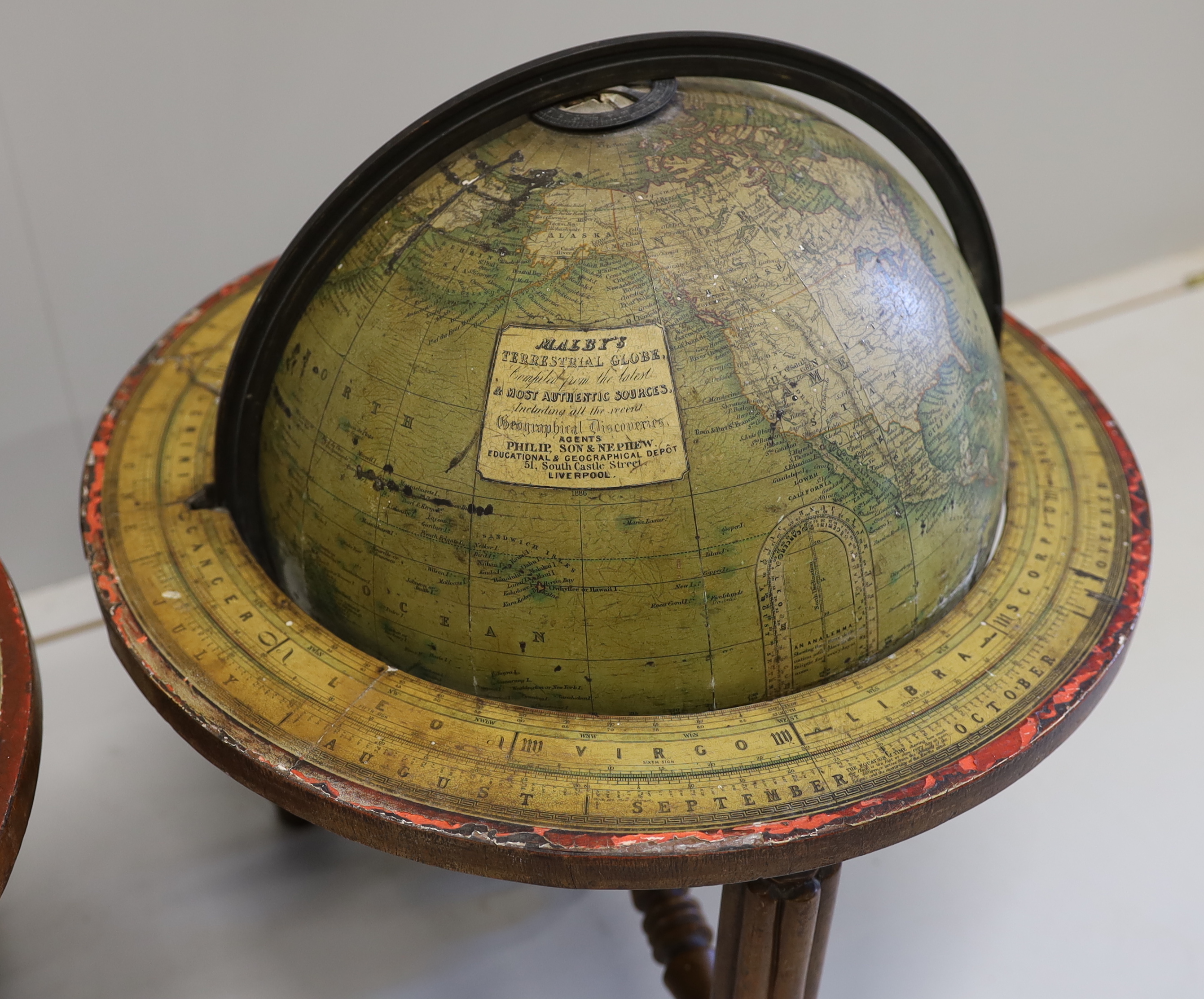 A pair of 19th century 12 inch table top library globes on stands by Malby